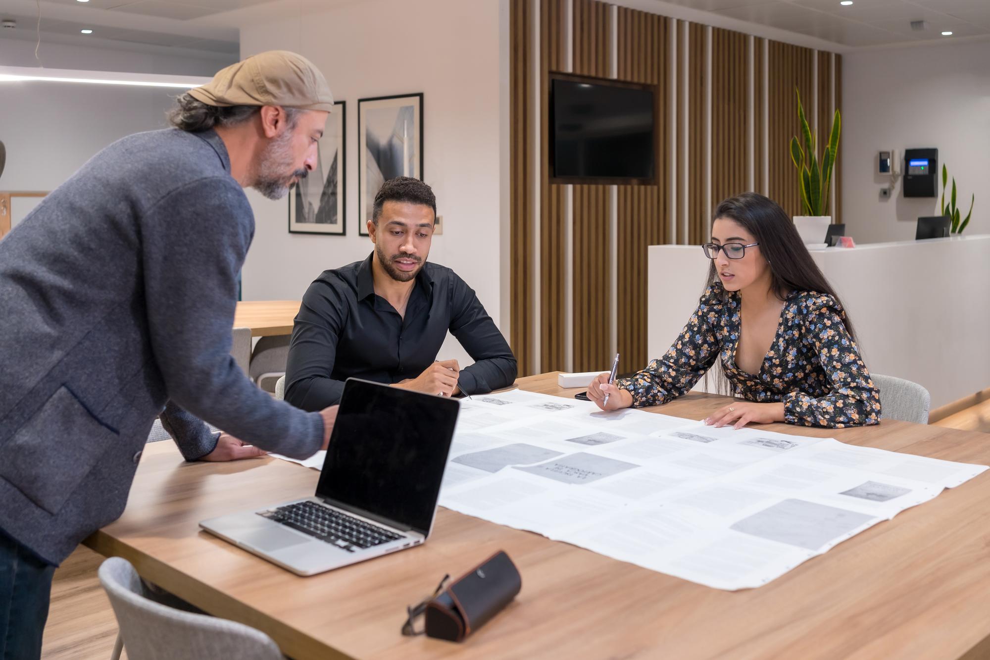 real estate agent showing floor plan